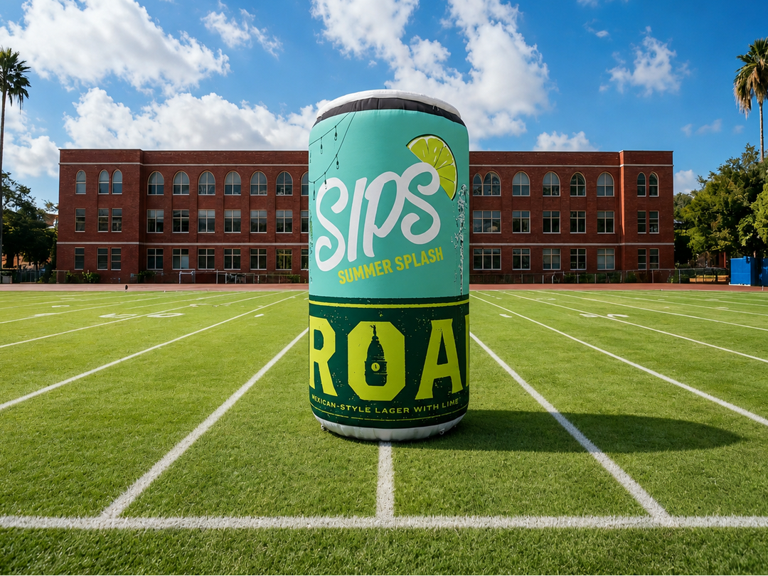 Sips ROA inflatable can on a football field with a school building in the background