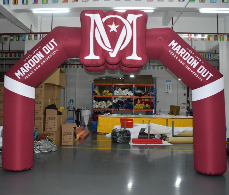 inflatable arch with Texas A&M Maroon Out branding and oversized logo topper