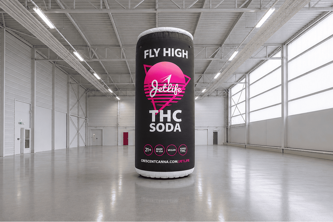  THC soda inflatable canister with 'Fly High' and 'Jellifly' branding in a warehouse setting.