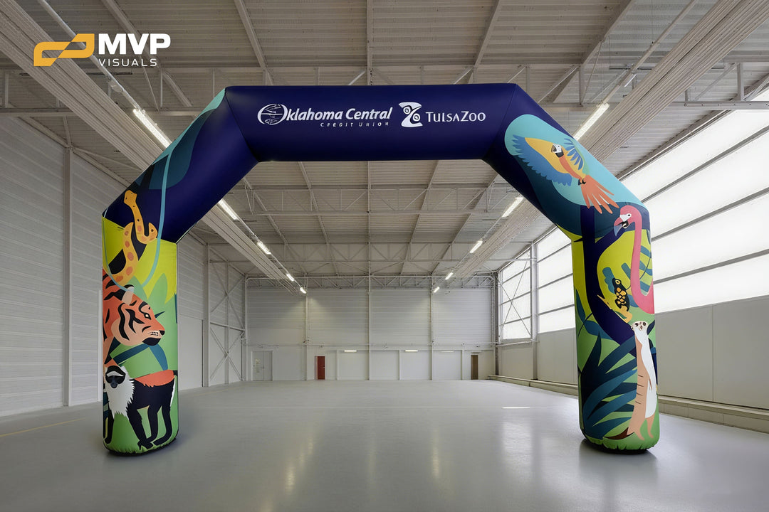 Vibrant inflatable arch with zoo animal illustrations and Tulsa Zoo and Oklahoma Central Credit Union logos
