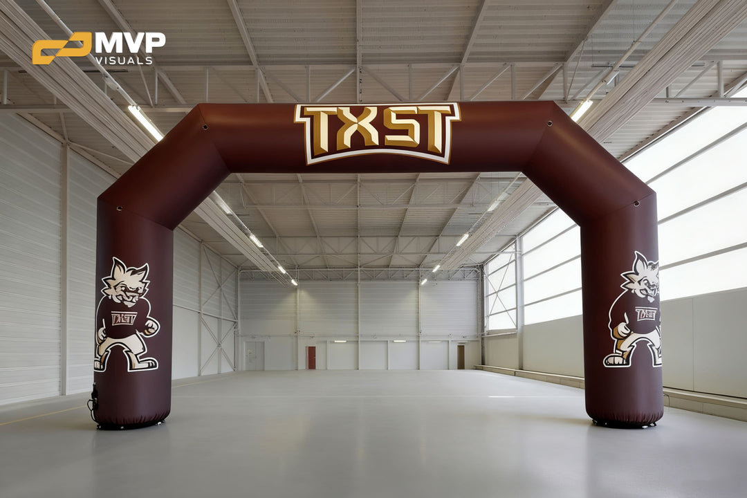 Maroon inflatable arch with TXST logo and bobcat mascot