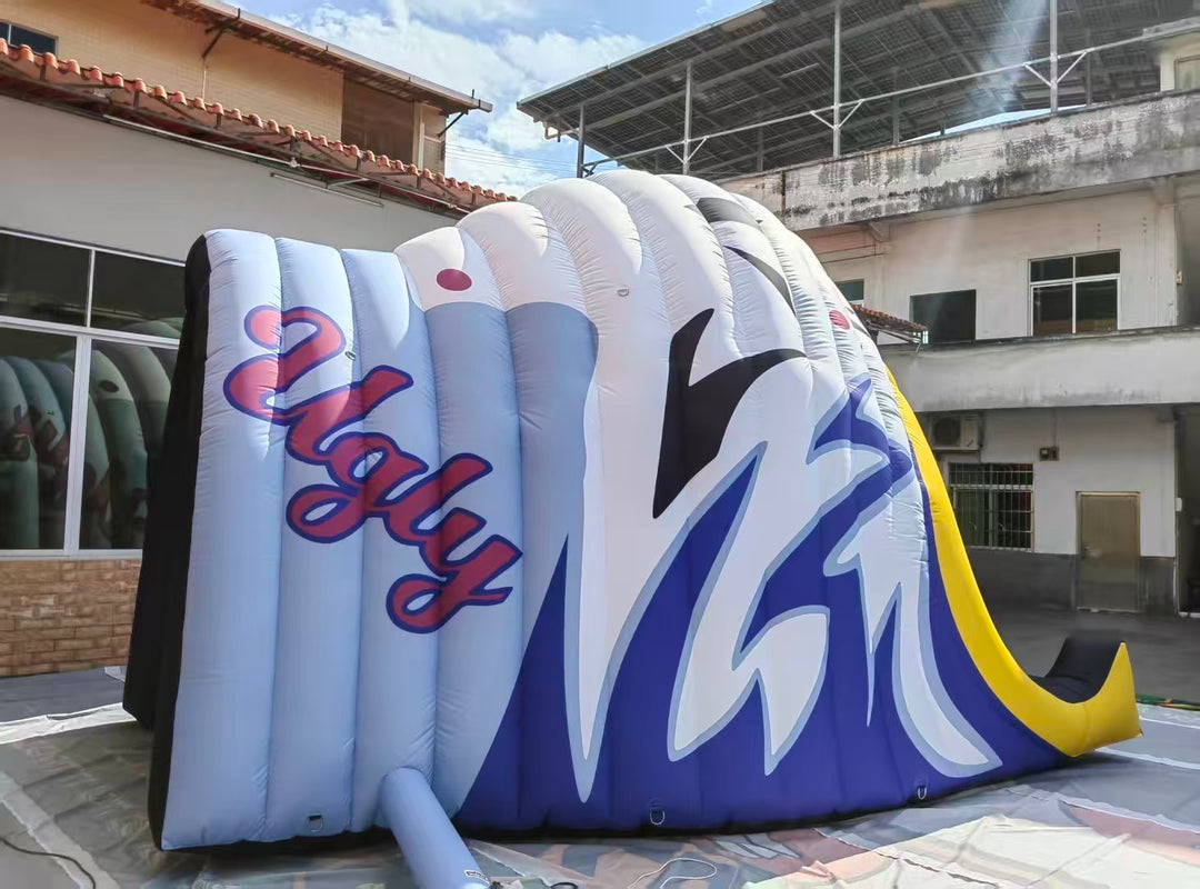 custom inflatable helmet tunnel with stylized "Ugly" logo and wave design