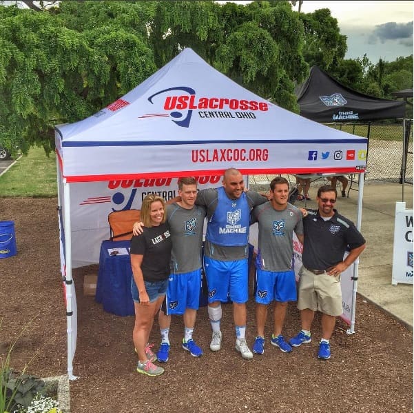 US Lacrosse Central Ohio custom canopy tent at community event with athletes posing for photos with fans