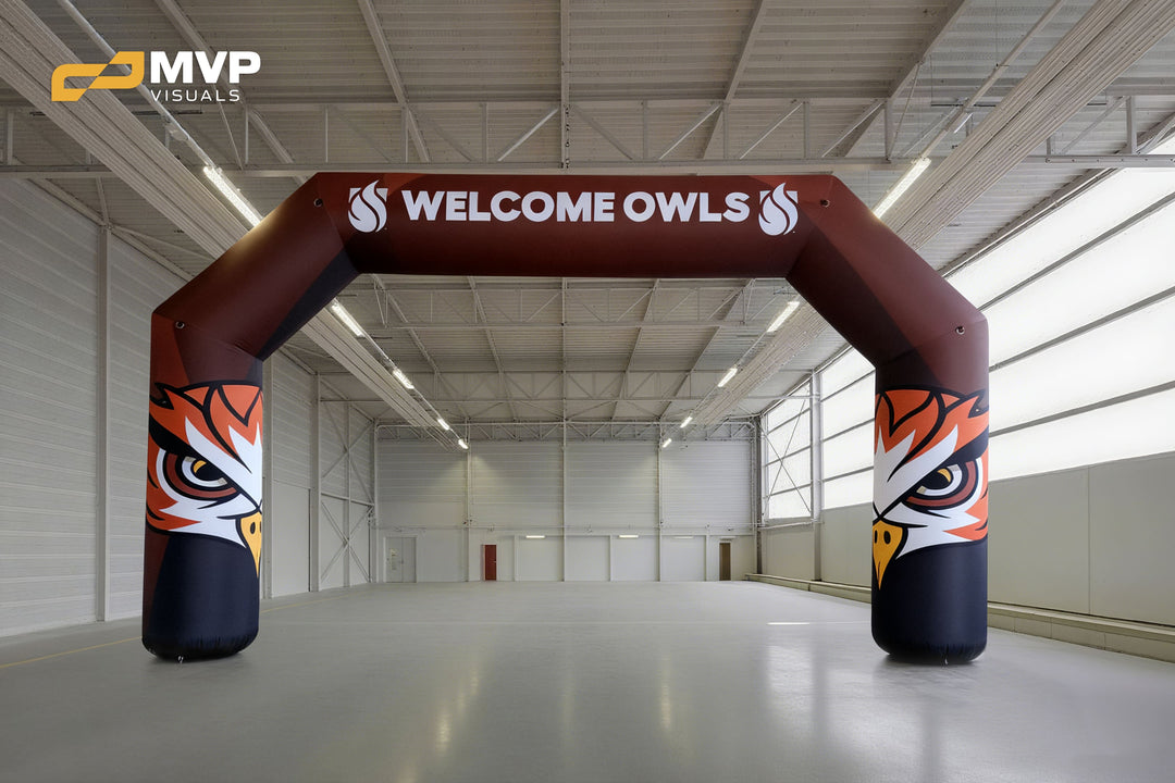 Inflatable arch with owl mascot and “Welcome Owls” message