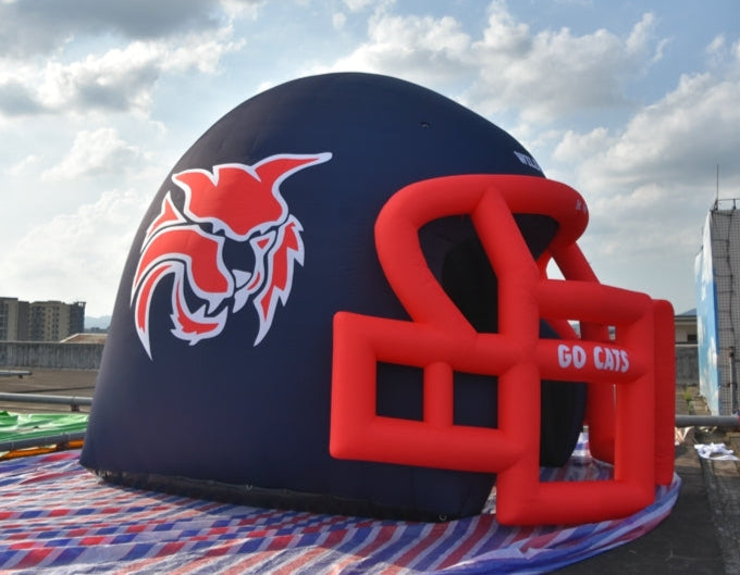 Side view of inflatable Wildcats helmet tunnel with red wildcat logo
