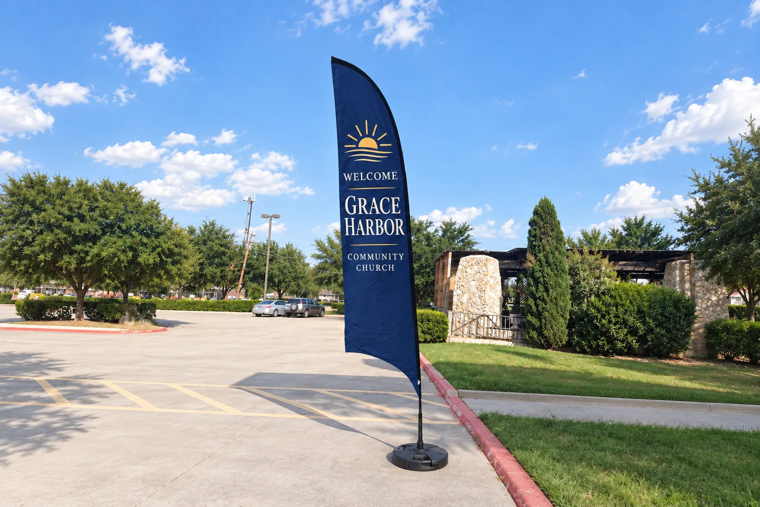 Blue welcome flag beside a church parking area and entrance