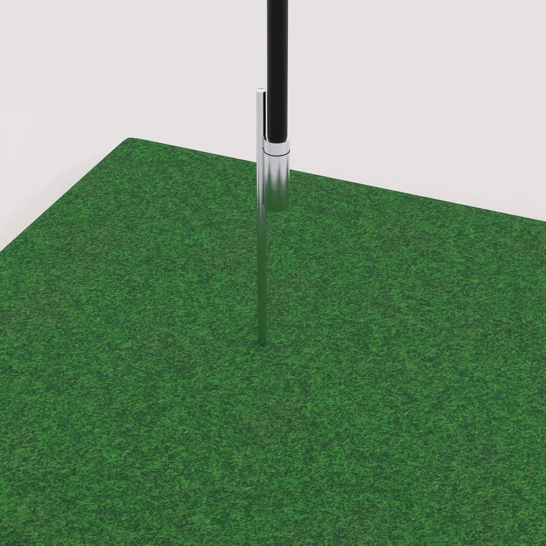 Ground stake installed in grass for a custom flag pole